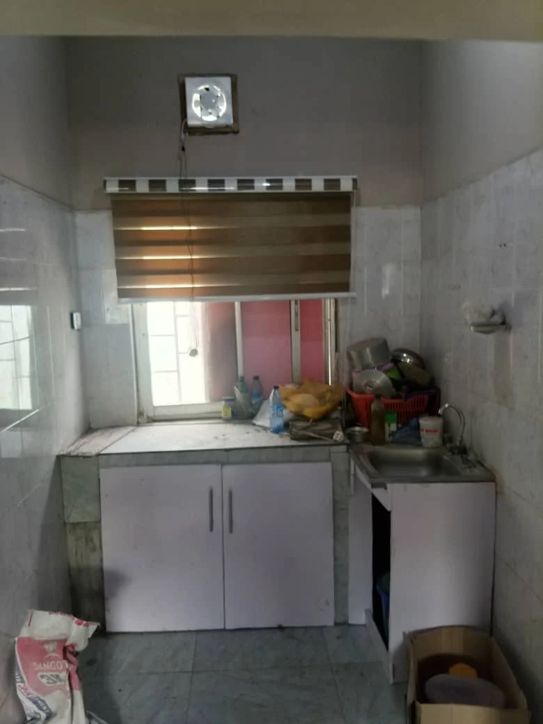 Company project photograph of kitchen cabinetry and tiled interior surfaces
